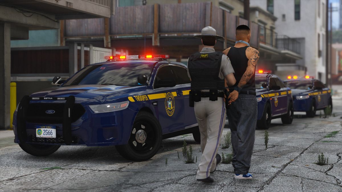 A player being arrested at the roadside by
          a state trooper.